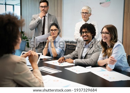 Group of business people working together, brainstorming in office