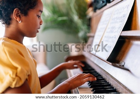 Image, Stock Photo Child practicing piano