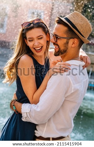 Similar – Image, Stock Photo Positive multiethnic couple kissing on street