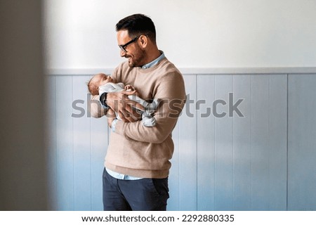 Similar – Image, Stock Photo Single male parent carrying her baby with a backpack