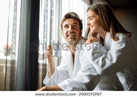 Similar – Image, Stock Photo Happy multiethnic lovers resting on sofa and kissing at home