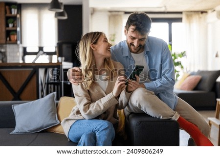 Similar – Image, Stock Photo Loving couple embracing while sitting on apartment floor