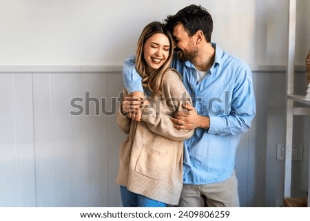 Similar – Image, Stock Photo Happy multiethnic lovers resting on sofa and kissing at home