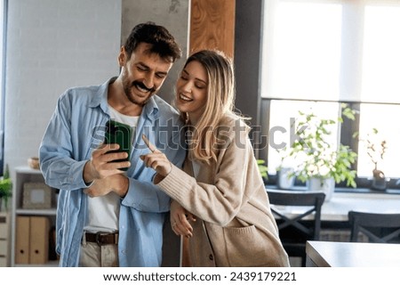 Image, Stock Photo Loving couple embracing while sitting on apartment floor