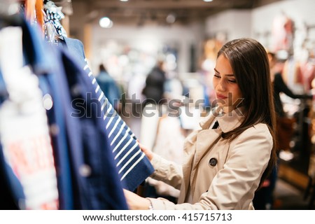 Beautiful businesswoman buying clothes 商業照片 © 