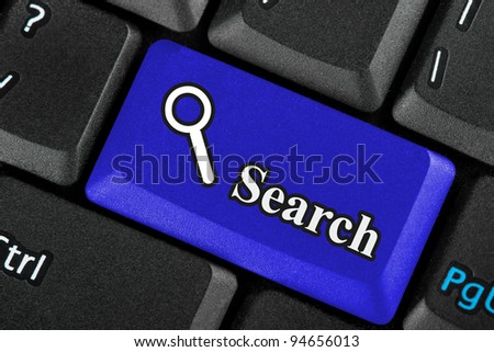 Closeup Blue search icon button on a keyboard