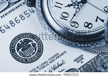 Time and money concept image. Pocket watch and US currency