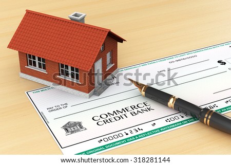 Bank Check with House and pen on the table
