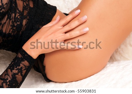 The body of a amazing young woman in sexy black lingerie with well formed hands and nails.