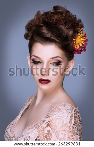 Fashion Beauty Model Girl with Flowers Hair. Bride. Perfect Creative Make up and Hair Style. Hairstyle. Bouquet of Beautiful Flower in hair