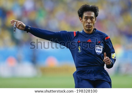 SAO PAULO, BRAZIL - June 12, 2014: Referee Yuichi Nishimura gestures during Group A opening game between Brazil and Croatia at Corinthians Arena. No Use in Brazil.