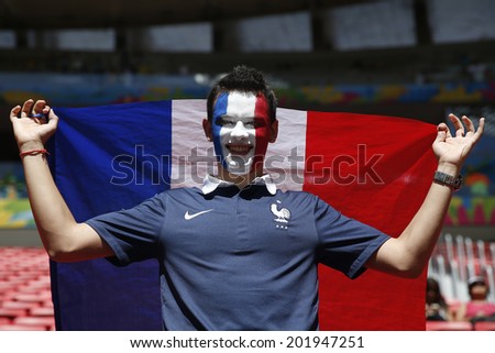 BRASILIA, BRAZIL - June 30, 2014: Soccer fan of France celebrating at the 2014 World Cup Round of 16 game between France and Nigeria at Estadio Nacional Mane Garrincha. No Use in Brazil.