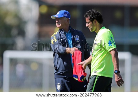 RIO DE JANEIRO, BRAZIL - July 2, 2014: Scolari coach and Fred of the Brazil national football team during training at Granja Comary training camp in Teresopolis, RJ. NO USE IN BRAZIL.