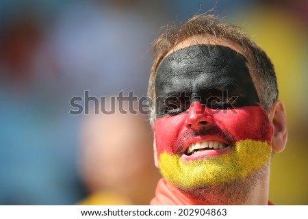 RIO DE JANEIRO, BRAZIL - JULY 04, 2014: Soccer fan of Germany celebrates during the World Cup Quarter-finals game between France and Germany in the Estadio Maracana. NO USE IN BRAZIL.