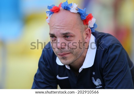 RIO DE JANEIRO, BRAZIL - JULY 04, 2014: Soccer fan of France reacts to France\'s loss at the World Cup Quarter-finals game between France and Germany in the Estadio Maracana. NO USE IN BRAZIL.