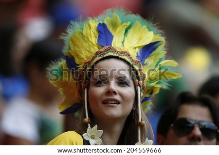 BRASILIA, BRAZIL - JULY 12, 2014: Soccer fan of Brazil during the World Cup Third place game between Brazil and the Netherlands in the Estadio Nacional. NO USE IN BRAZIL.