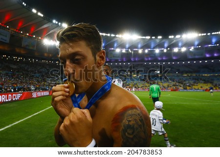RIO DE JANEIRO, BRAZIL - July 13, 2014: Oezil of Germany celebrate with his medal winning the 2014 World Cup Final game between Argentina and Germany at Maracana Stadium. NO USE IN BRAZIL.