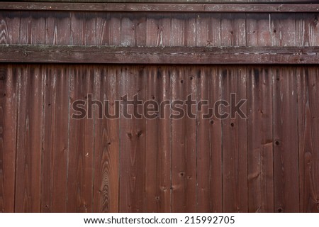 Old weathered timber fence showing rust streaks running from the old rusted nails.