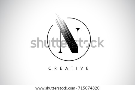 N Brush Stroke Letter Logo Design. Black Paint Logo Leters Icon with Elegant Circle Vector Design. Stock fotó © 