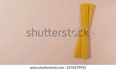 Similar – Image, Stock Photo Uncooked spaghetti noodles, flat lay