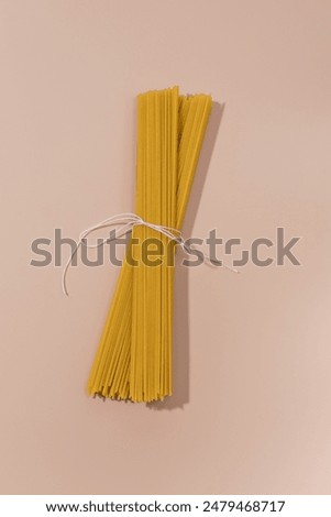 Similar – Image, Stock Photo Uncooked spaghetti noodles, flat lay