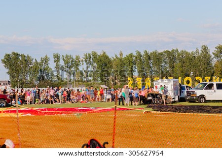 SAINT-JEAN-SUR-RICHELIEU, QUEBEC, CANADA - AUGUST 9, 2015 : Crowd of viewers on Montgolfieres - The 8 Hot Air Balloons Festival Fleet in Saint-Jean-Sur-Richelieu, Canada on August 8, 2015