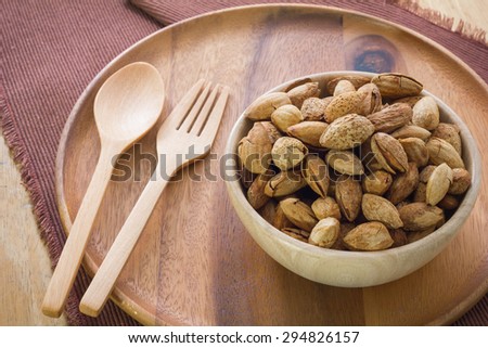 Almond in the wood bowl for lose weight