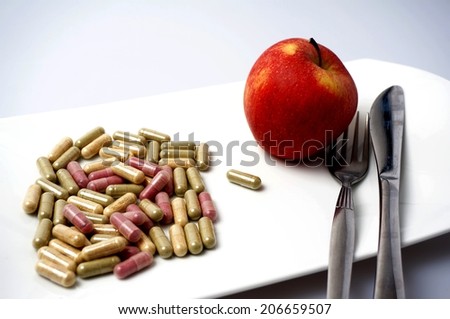Medicine capsule vs healthy apple