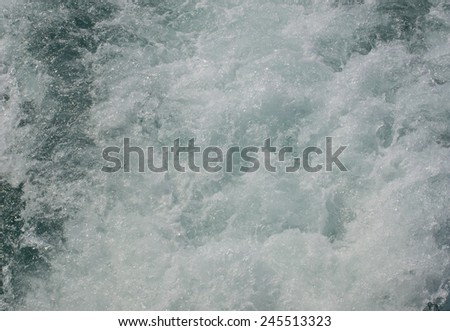 Surface of the water or the pressure of the air bubbles in the water