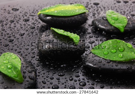 wellness massage or bath concept with zen stones leafes and water drop