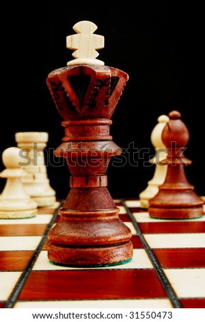 chess pieces showing power competition conflict and strategy in business