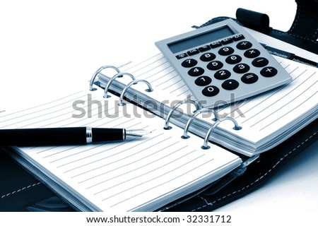 business organizer, notebook or planner with pen