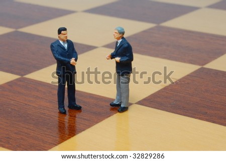 group uf business people standing on a chess board