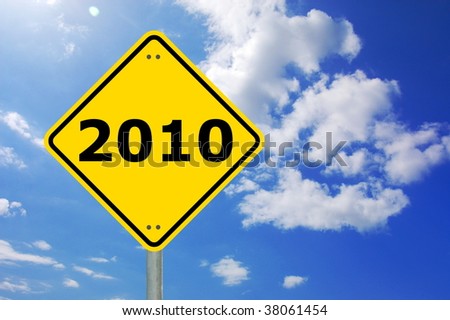 yellow road sign with year 2010 and blue sky