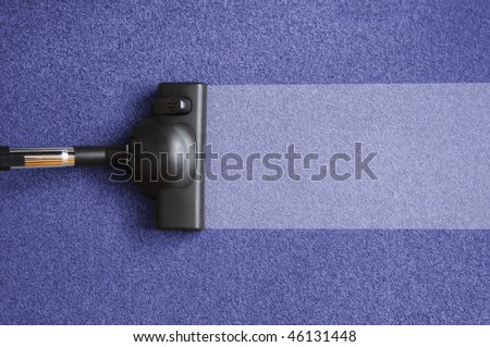 vacuum cleaner on the floor showing house cleaning concept