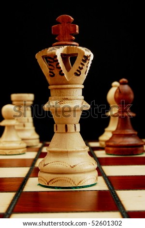 chess pieces showing power competition conflict and strategy in business