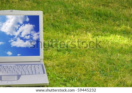 laptop and blue sky showing nature concept with copyspace