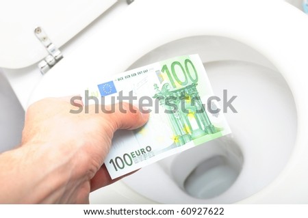 waste of money concept with euro bill and toilet
