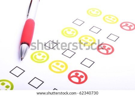 hand pen and check box or tick box with smilie