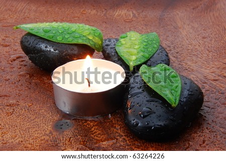 zen stones and leaves showing a wellness or bath concept
