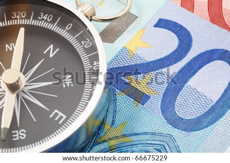 euro money and compass showing financial success