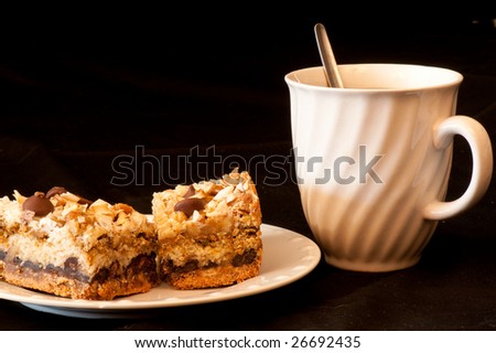 Closeup of dessert bar and a cup of coffee.