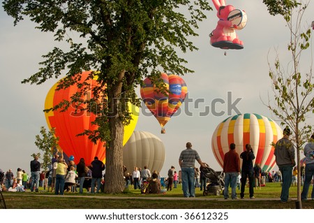 COLORADO SPRINGS, COLORADO -SEPTEMBER 6: Hot air balloons fill the sky with the crowd looking on at the Hot Air Balloon Festival on September 6, 2009 in Colorado Springs, Colorado.