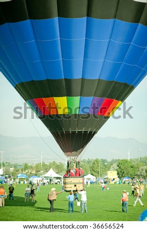 COLORADO SPRINGS, COLORADO - SEPTEMBER 6: Hot air balloon landing during the Colorado Springs Hot Air Balloon Festival on September 6, 2009 in Colorado Springs, Colorado.