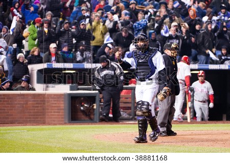 DENVER, COLORADO - OCTOBER 11:  Yorvit Torrealba of the Rockies clenches his fist in joy to end the inning in game 3 of the Rockies, Phillies NLDS on October 11, 2009 in Denver Colorado.
