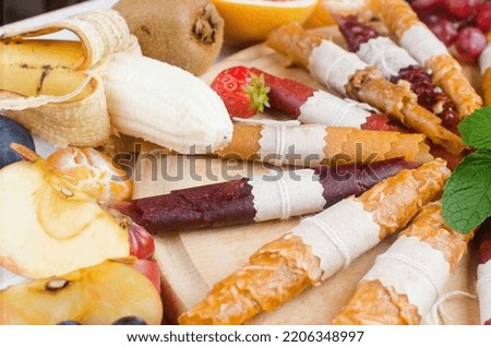 assortied dried chips and ripe fruits on grey background. Fruit chips. Healthy eating concept, snack, no sugar. Top view, copy space.  Photo stock © 