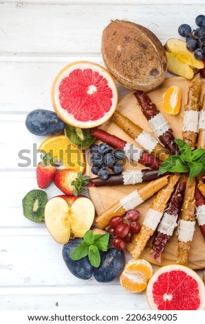 assortied dried chips and ripe fruits on grey background. Fruit chips. Healthy eating concept, snack, no sugar. Top view, copy space.  Photo stock © 