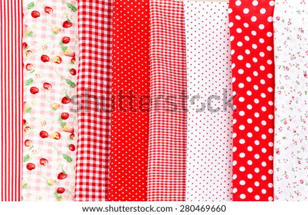 set of colorful fabrics, spools of thread and scissors. accessories for cutting and sewing