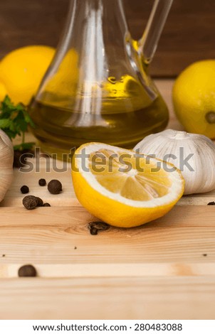 Flavourings for cooking meat. slices of lemon, garlic cloves and parsley on white background