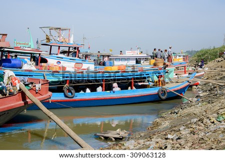 13 JANUARY 2015 - MANDALAY, MYANMAR - Tourist boats and ferries line the Irrawaddy River bank at Mandalay, Myanmar